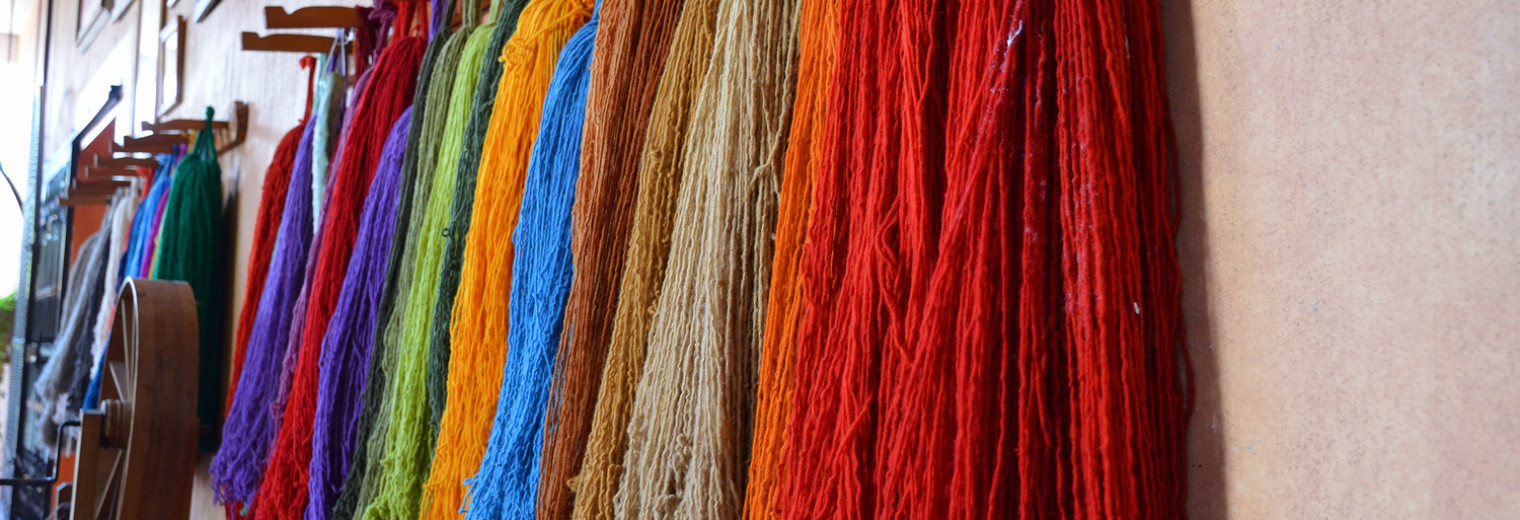 carding wool to make rugs in teotitlan del valle, oaxaca