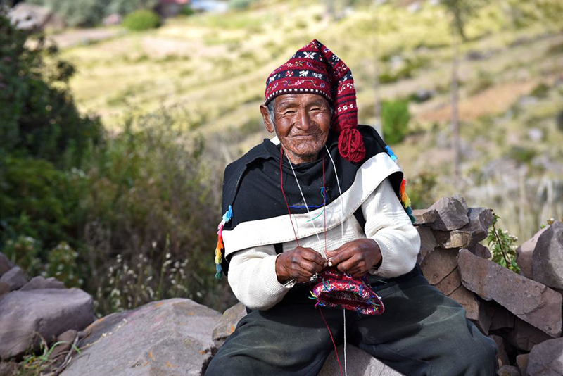 Local man on Taquile Island Peru Llama Travel