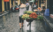 Woman carrying fruit, Hanoi